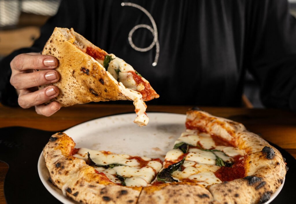 Criză pe piața alimentară din SUA. Cum a ajuns pizza, de la mâncarea ieftină, la un produs de lux
